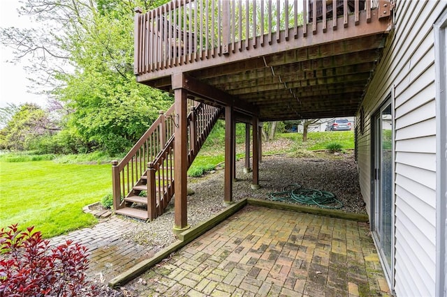 view of patio / terrace with stairway and a deck