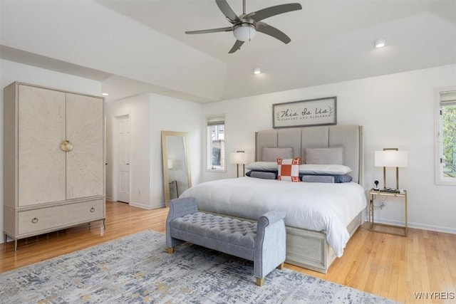 bedroom featuring wood finished floors, baseboards, recessed lighting, vaulted ceiling, and a ceiling fan