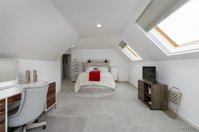 carpeted bedroom featuring a skylight, an office area, lofted ceiling, recessed lighting, and baseboards