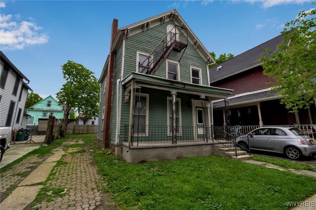 72 Mariner St, Buffalo, NY 14201 - view of front of home with a porch and a chimney