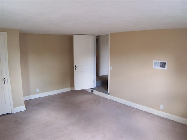 unfurnished bedroom with baseboards and carpet