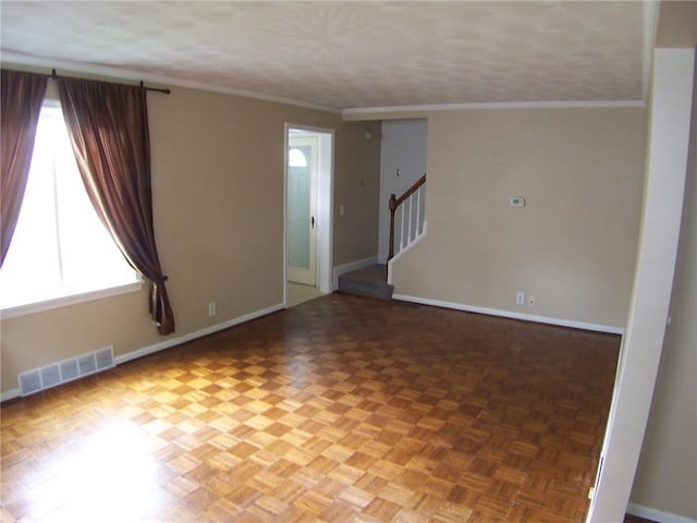 unfurnished room featuring baseboards, stairway, and ornamental molding
