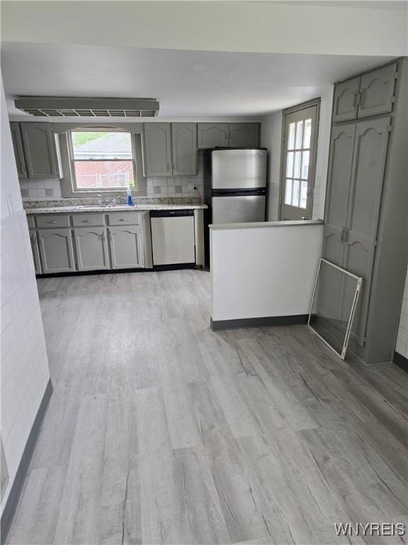 56 Gibbons St, Lackawanna, NY 14218 - kitchen with appliances with stainless steel finishes, gray cabinetry, and light wood-style flooring