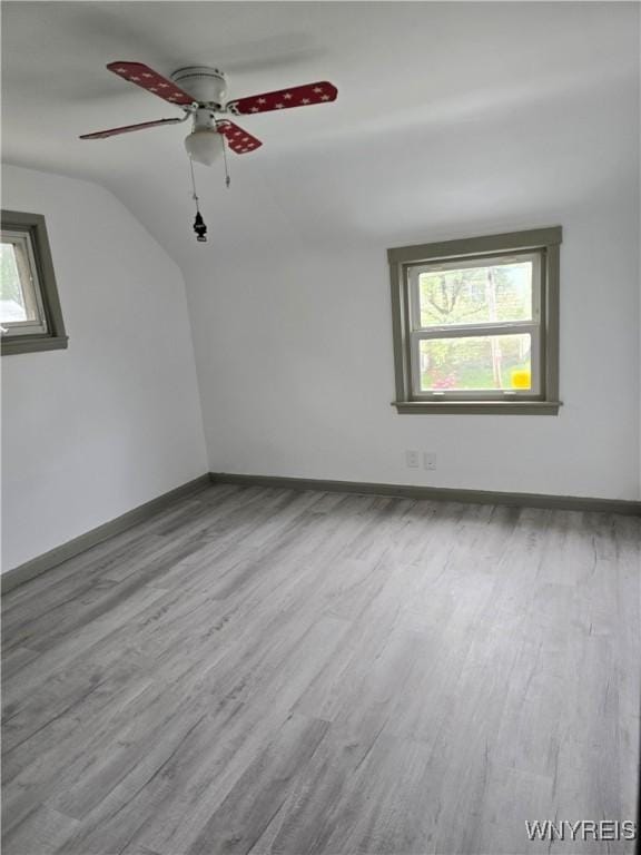56 Gibbons St, Lackawanna, NY 14218 - spare room featuring wood finished floors, baseboards, ceiling fan, and vaulted ceiling