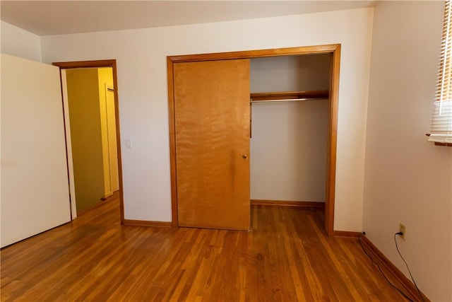 100 Parkview Dr, Erwin, NY 14870 - unfurnished bedroom featuring wood finished floors, a closet, and baseboards