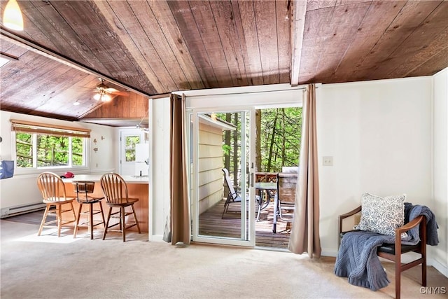 doorway featuring wood ceiling, a baseboard heating unit, carpet floors, and ceiling fan