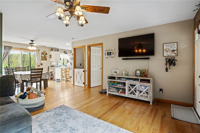 3760 N Creek Rd, Palmyra, NY 14522 - living room featuring ceiling fan, light wood-type flooring, and baseboards