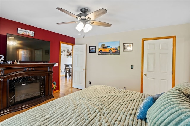3760 N Creek Rd, Palmyra, NY 14522 - bedroom with wood finished floors, a ceiling fan, and a premium fireplace