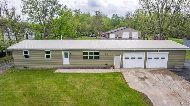 7498 Roberts St, Lenox, NY 13032 - view of front of home with a front lawn, driveway, and a metal roof