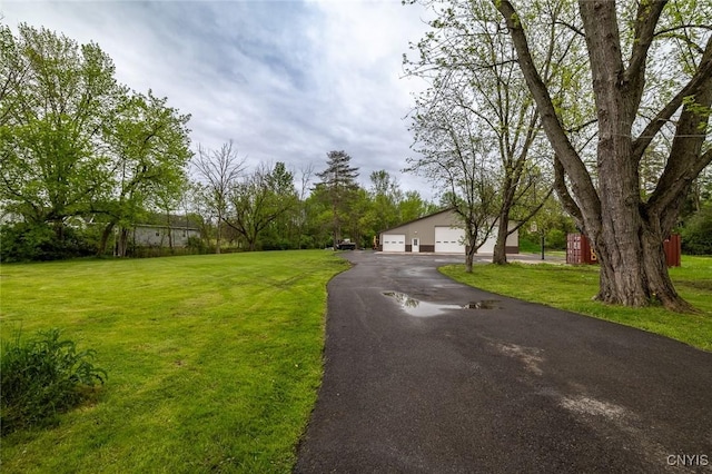 7498 Roberts St, Lenox, NY 13032 - view of front of home with a front yard and a detached garage