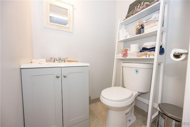 2282 Seneca St, Buffalo, NY 14210 - half bathroom featuring toilet, baseboards, and vanity