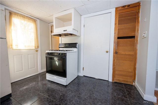2282 Seneca St, Buffalo, NY 14210 - kitchen with gas range oven, under cabinet range hood, baseboards, and a drop ceiling
