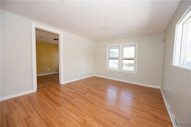 2282 Seneca St, Buffalo, NY 14210 - spare room featuring light wood-type flooring and baseboards
