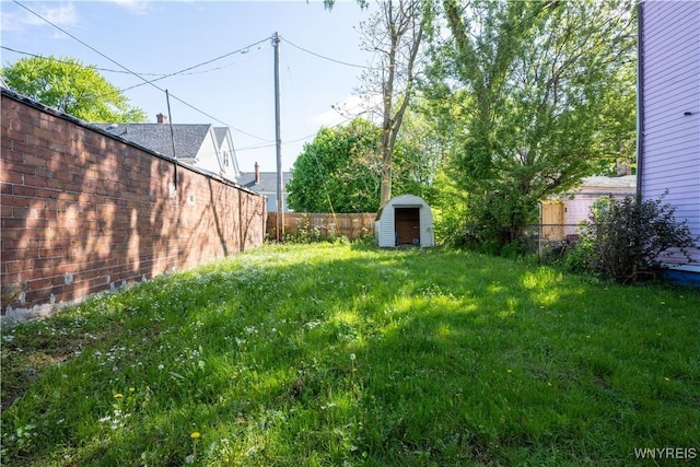 2282 Seneca St, Buffalo, NY 14210 - view of yard featuring a storage unit and an outbuilding