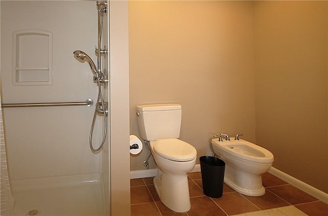 31 Jefreelind Dr, Greece, NY 14616 - bathroom with tile patterned flooring, a bidet, a stall shower, toilet, and baseboards