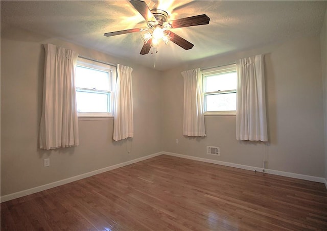 31 Jefreelind Dr, Greece, NY 14616 - unfurnished room with wood finished floors, baseboards, ceiling fan, and a textured ceiling