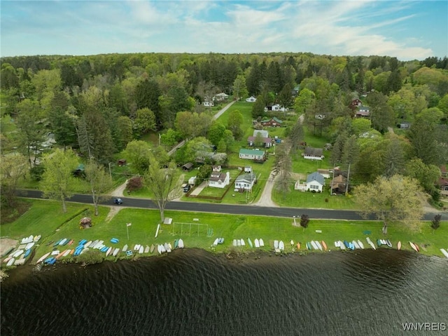 aerial view of property and surrounding area with a large body of water