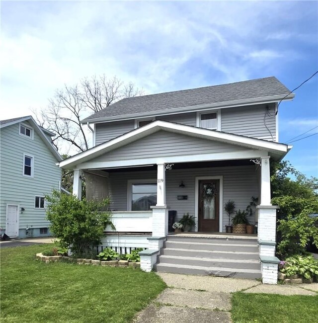 119 Verona St, Elmira, NY 14903 - view of front of property featuring covered porch, a front yard, and roof with shingles