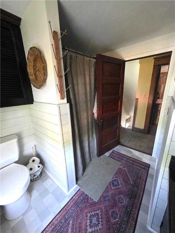 119 Verona St, Elmira, NY 14903 - bathroom featuring toilet and curtained shower