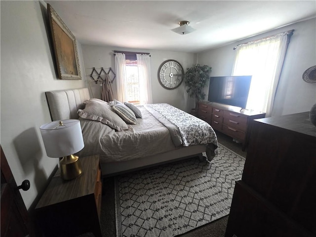 119 Verona St, Elmira, NY 14903 - bedroom featuring multiple windows and dark colored carpet