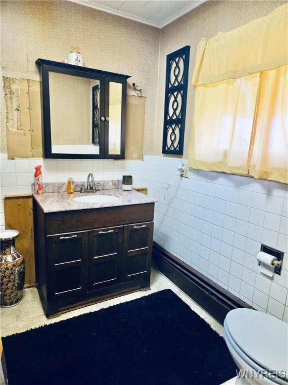 11343 Slade Rd, Ridgeway, NY 14103 - bathroom with tile walls, vanity, toilet, and tile patterned floors