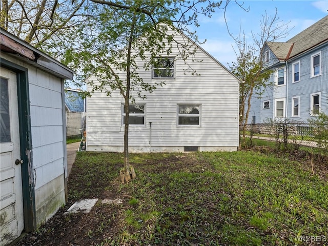 view of home's exterior featuring fence