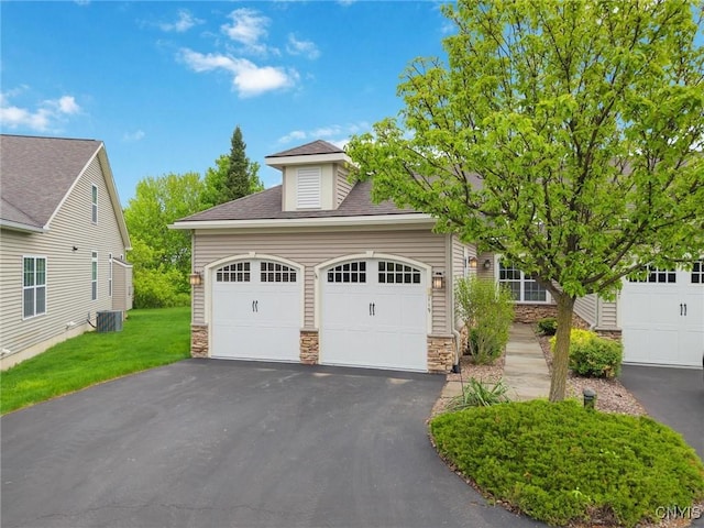119 Star Gaze Cir, Manlius, NY 13066 - view of front of property featuring stone siding, asphalt driveway, a shingled roof, and a front lawn