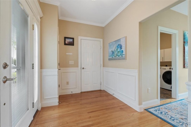 119 Star Gaze Cir, Manlius, NY 13066 - entryway with washer / clothes dryer, light wood finished floors, ornamental molding, wainscoting, and a decorative wall