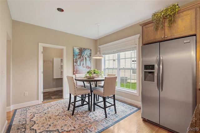 119 Star Gaze Cir, Manlius, NY 13066 - dining room with baseboards and light wood-style floors