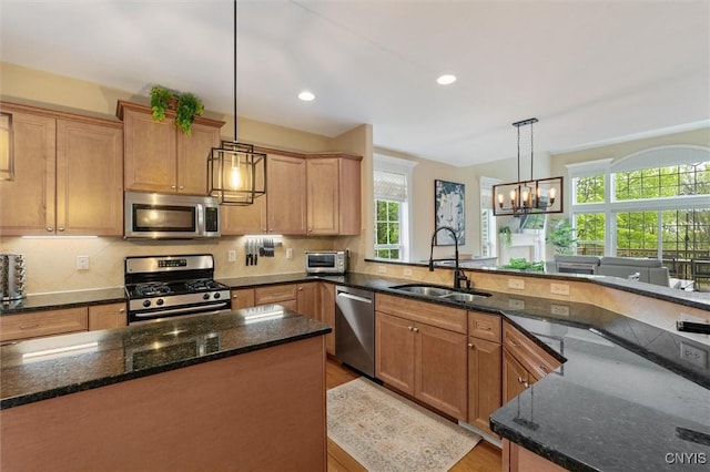 119 Star Gaze Cir, Manlius, NY 13066 - kitchen with appliances with stainless steel finishes, a sink, healthy amount of natural light, a chandelier, and recessed lighting
