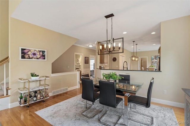 119 Star Gaze Cir, Manlius, NY 13066 - dining space featuring a chandelier, light wood-style floors, recessed lighting, and baseboards
