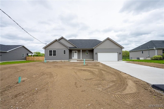 2536 Beverly Dr, Eden, NY 14057 - view of front of house with concrete driveway, a garage, and fence