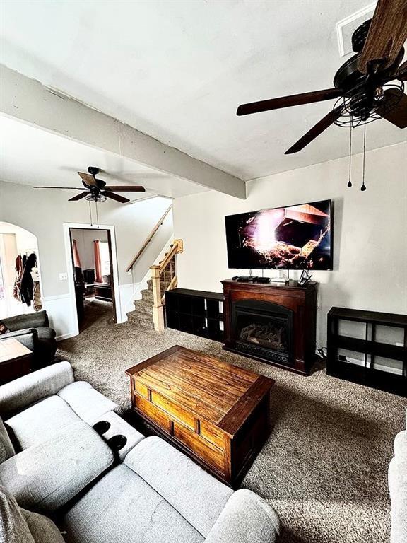 426 Loder St, Barton, NY 14892 - living room featuring ceiling fan, carpet, stairway, and a fireplace