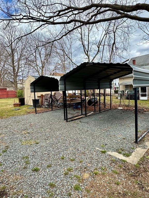426 Loder St, Barton, NY 14892 - view of parking / parking lot with a carport and fence