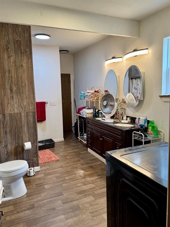 426 Loder St, Barton, NY 14892 - bathroom with wood finished floors, toilet, and vanity