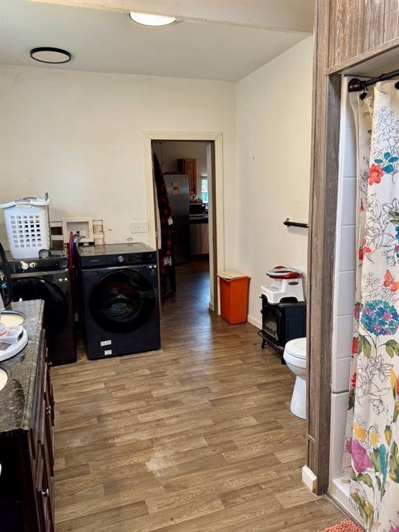 426 Loder St, Barton, NY 14892 - laundry room featuring washer / clothes dryer and wood finished floors