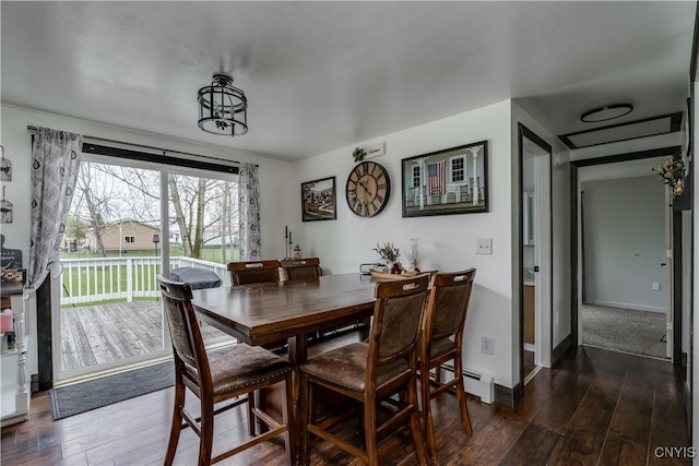 36852 Middle Rd, Orleans, NY 13656 - dining area with a baseboard radiator and dark wood finished floors