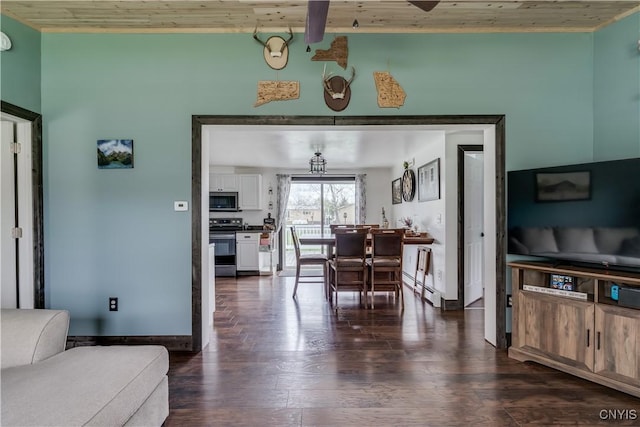 36852 Middle Rd, Orleans, NY 13656 - dining room featuring wood ceiling, dark wood-style flooring, baseboards, and a baseboard heating unit