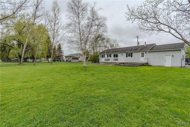 36852 Middle Rd, Orleans, NY 13656 - view of green lawn featuring a deck