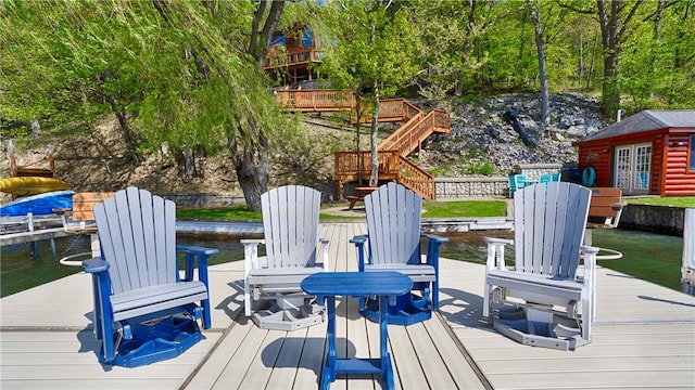 1267 S Lake Rd, Middlesex, NY 14507 - wooden terrace with a boat dock, a water view, and an outdoor structure