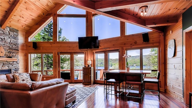 1267 S Lake Rd, Middlesex, NY 14507 - living area featuring hardwood / wood-style floors, wooden walls, wood ceiling, and a stone fireplace