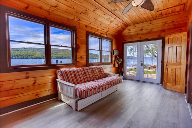 1267 S Lake Rd, Middlesex, NY 14507 - living area with lofted ceiling, french doors, wooden ceiling, wood walls, and a ceiling fan