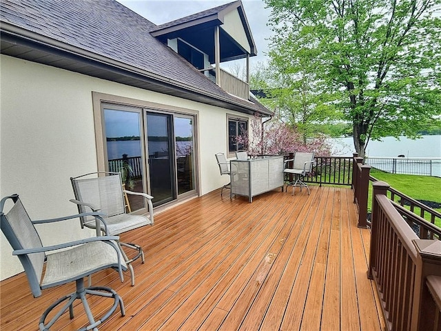 wooden deck featuring outdoor dining space and fence