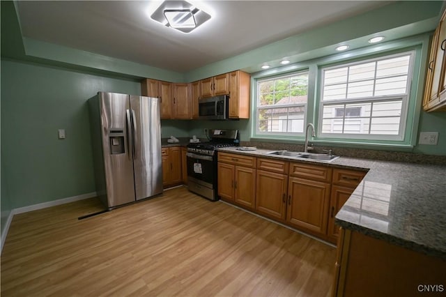 11 White St, Kirkland, NY 13323 - kitchen featuring appliances with stainless steel finishes, a sink, light wood finished floors, brown cabinets, and recessed lighting