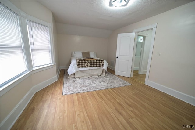 11 White St, Kirkland, NY 13323 - bedroom featuring lofted ceiling, wood finished floors, and baseboards