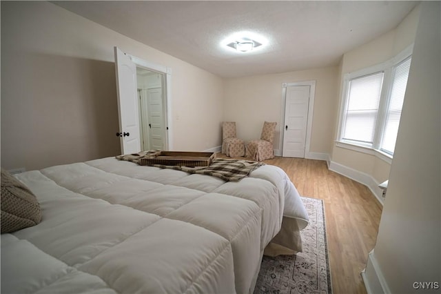 11 White St, Kirkland, NY 13323 - bedroom with baseboards and light wood-style flooring