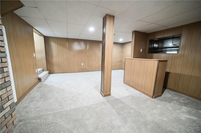 11 White St, Kirkland, NY 13323 - finished below grade area featuring carpet floors, wooden walls, a dry bar, a paneled ceiling, and baseboards