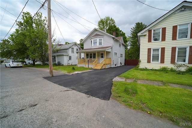 11 White St, Kirkland, NY 13323 - view of front of home featuring a porch and a front lawn