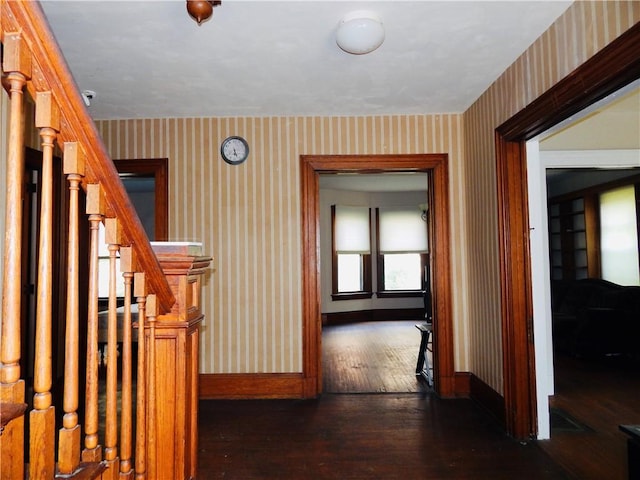 7 Walnut St, Oneonta-City, NY 13820 - corridor featuring wallpapered walls, baseboards, dark wood-style flooring, and stairway