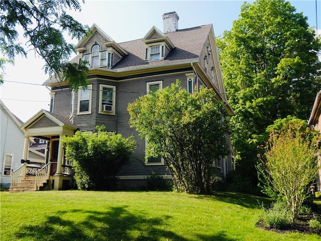 7 Walnut St, Oneonta-City, NY 13820 - view of front of home featuring a front lawn and a chimney
